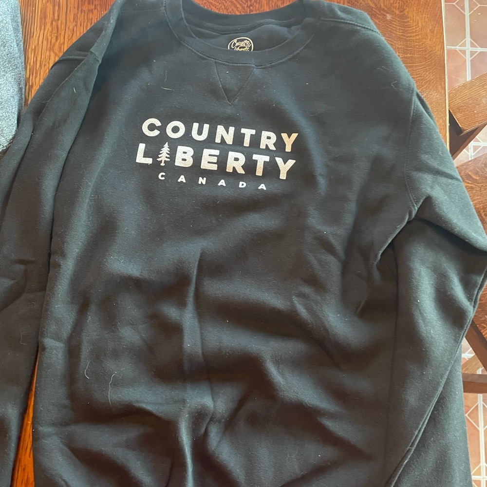 Brand new black Country Liberty sweater. Size medium